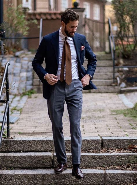 grey trousers navy blazer.